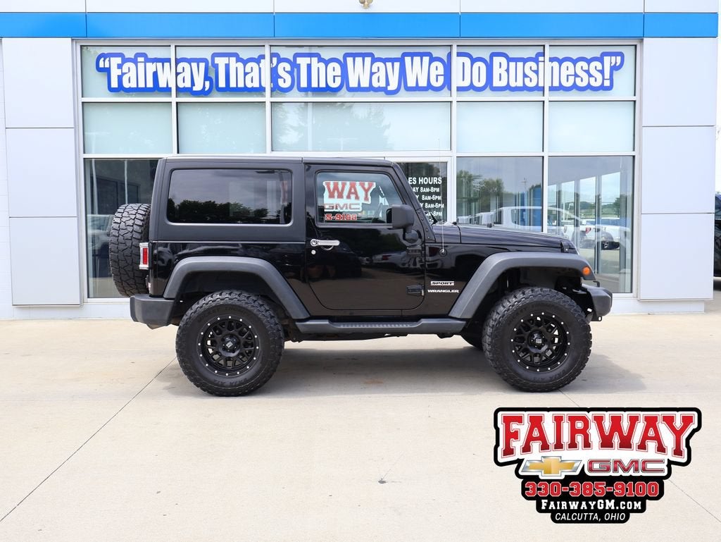 2015 Jeep Wrangler Sport in Black — front three-quarter view