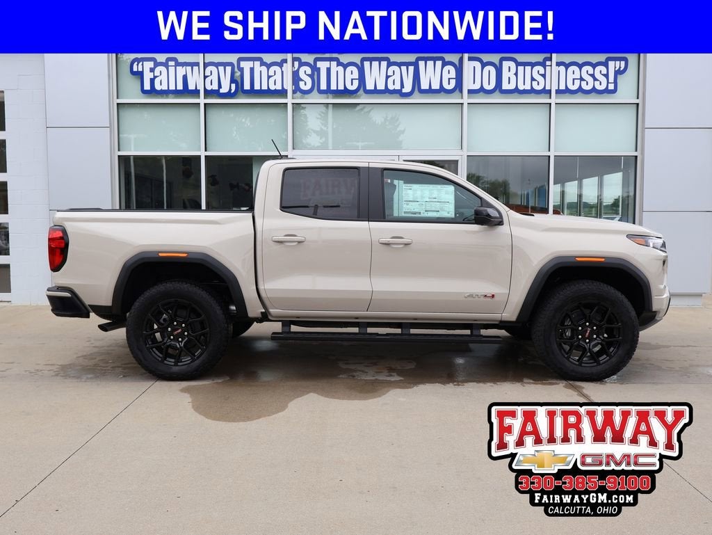 2026 GMC Canyon AT4 in Coastal Dune — front three-quarter view