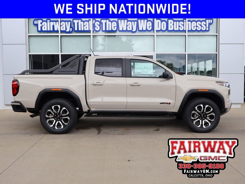 2026 GMC Canyon AT4 in Coastal Dune — front three-quarter view