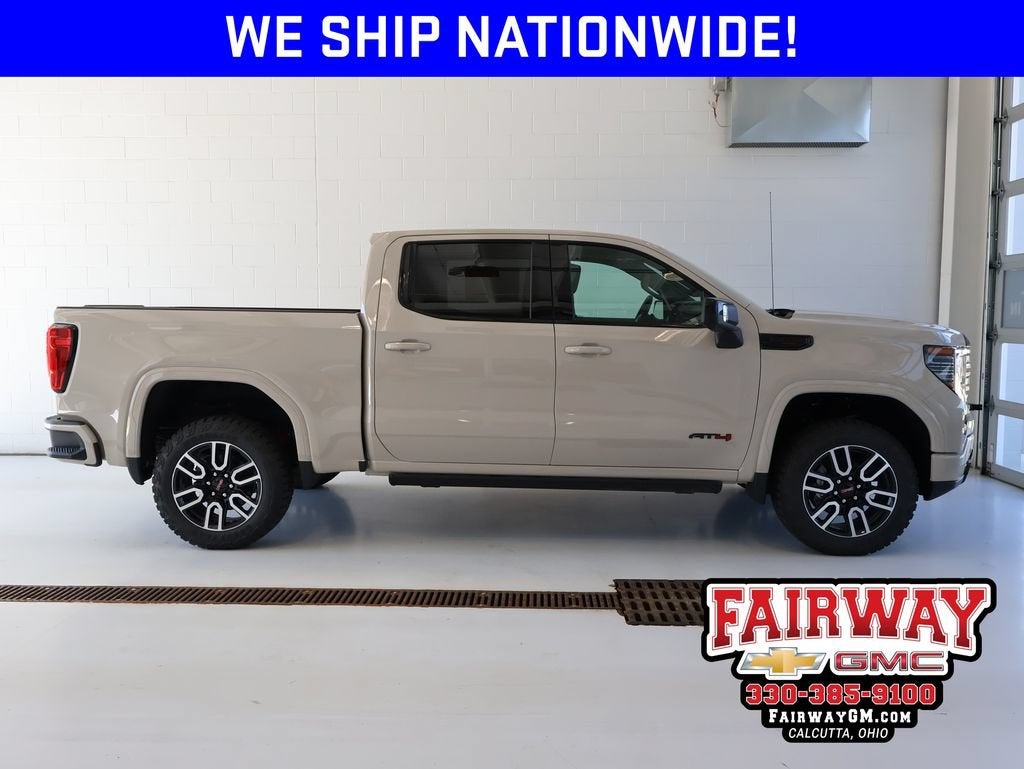 2026 GMC Sierra 1500 AT4 in Coastal Dune — front three-quarter view