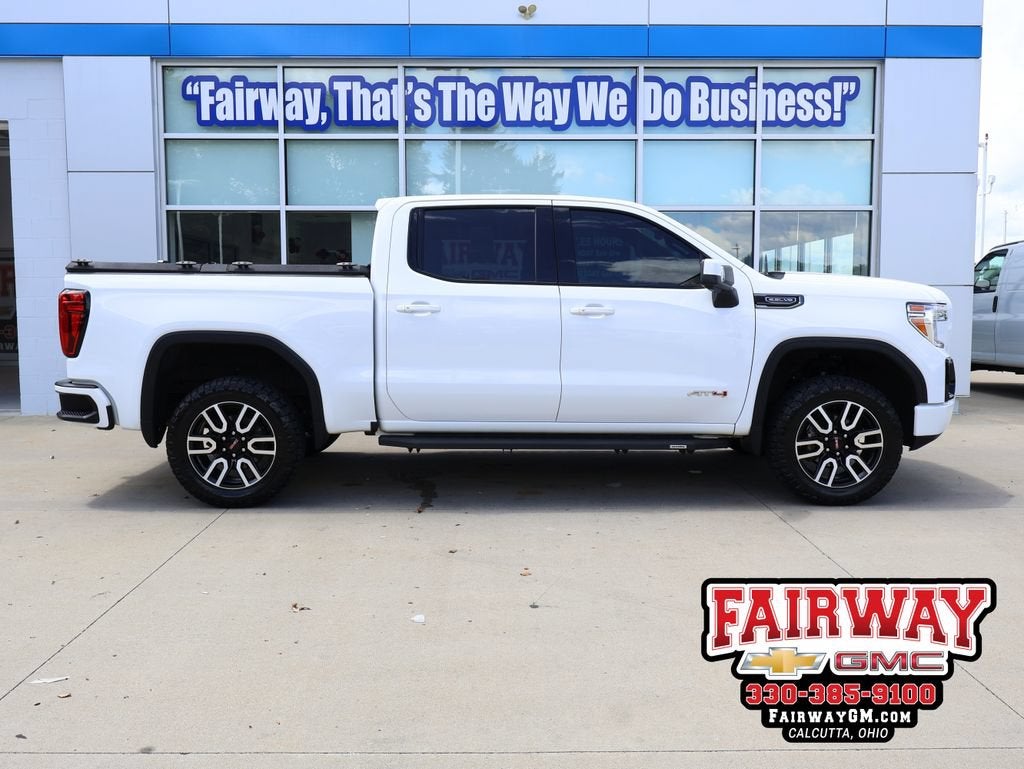 2021 GMC Sierra 1500 AT4 in Summit White — front three-quarter view
