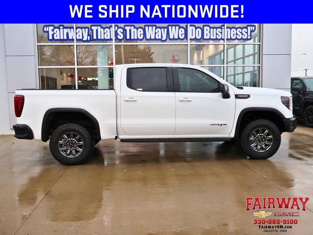 2025 GMC Sierra 1500 AT4X in Summit White — front three-quarter view